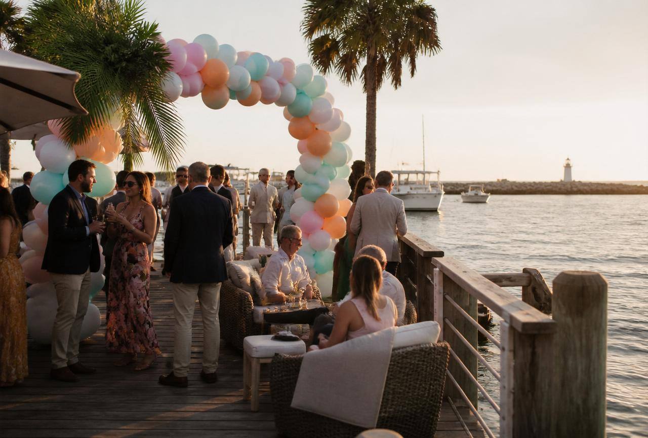Balloon Backdrops in Fort Pierce, FL — real party setup with Fort Pierce Inlet dock at sunset in the background